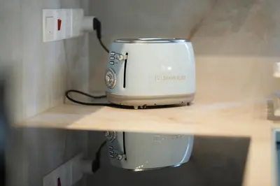 a toaster sitting on top of a shelf at Ocean Blue House 17 in Meneou