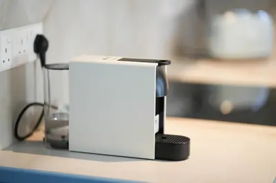 a black and white appliance sitting on a counter at Ocean Blue House 17 in Meneou