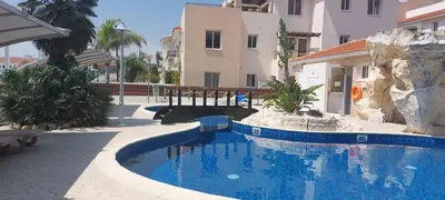 a swimming pool in the middle of a building at Pyla Palms A2 107 in Pyla