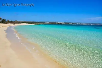 a view of a beach with the blue water at Nissi 3 Pool View Apartment in Ayia Napa