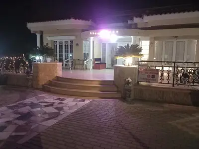 a house at night with stairs and a fire hydrant at Vasilis House family room in Larnaka