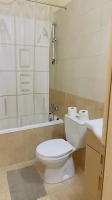 a bathroom with a toilet and a shower and a sink at Tersefanou Traditional Village Larnaca in Larnaka