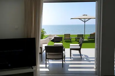 a living room with a view of the ocean at Meneou Houses by the Sea in Larnaka