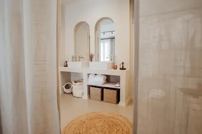 a bathroom with a sink and a mirror at Thymises Boutique Hotel in Kakopetria
