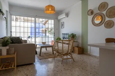 a living room with a couch and a table at Blossom 1-Bedroom Apartment in Larnaca in Larnaka