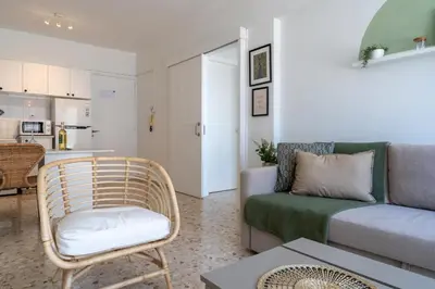 a living room with a couch and a chair at Blossom 1-Bedroom Apartment in Larnaca in Larnaka