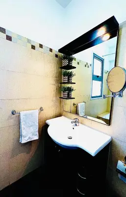 a bathroom with a white sink and a mirror at LARA 303 in Larnaka