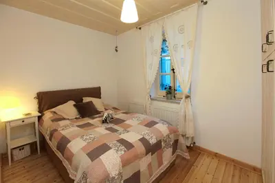 a bedroom with a bed and a window at Kalopanayiotis Cottage in Kalopanayiotis