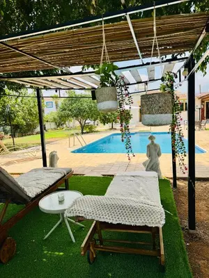 a patio with a swimming pool and a pergola at Villa Christina in Protaras