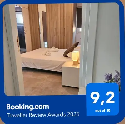 a hotel room with a bed and a mirror at SC_apartments in Kato Pyrgos