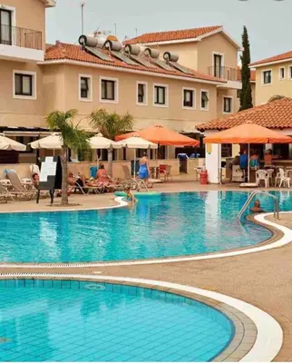 a large swimming pool in front of a hotel at Quiet kykladesAG10/near the beach, Paralimni in Paralimni