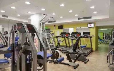 a gym with treadmills and elliptical machines at Quiet kykladesAG10/near the beach, Paralimni in Paralimni