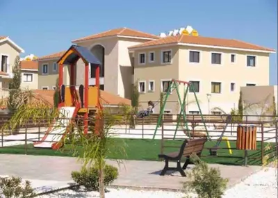 a park with a playground with a slide and swings at Quiet kykladesAG10/near the beach, Paralimni in Paralimni