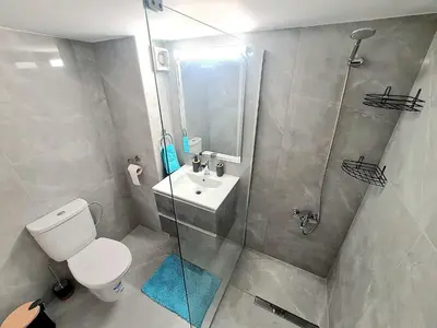 a bathroom with a shower and a toilet and a sink at Beach Serenity Studio on Makenzy in Larnaka