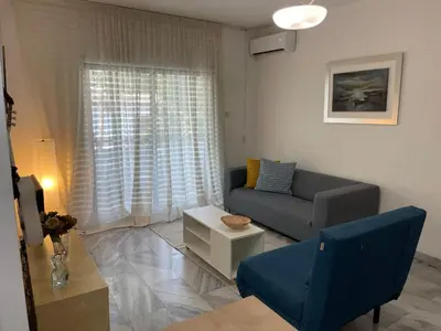 a living room with a couch and a table at Nicosia Downtown Cozy in Nicosia