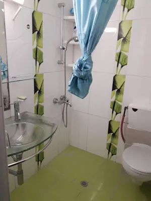 a bathroom with a sink and a toilet at A MODERN APARTMENT FOR YOU in Nicosia