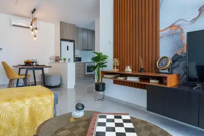 a living room with a table and a kitchen at Flair - 1-Bedroom Apartment & Balcony in Larnaca in Larnaka