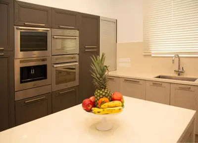 a bowl of fruit on a counter in a kitchen at Seafront Villa Layla by Ruidoso Luxury in Ayia Napa