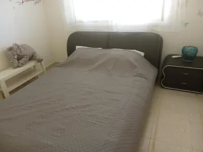 a large bed in a bedroom with a window at 2 bedroom apartment in Makenzi in Larnaka