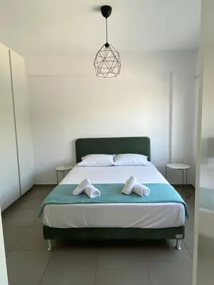 a bedroom with a bed with two towels on it at Anastasia 1 Bedroom Apartment in Limassol