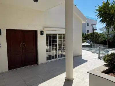 a entrance to a building with a brown door at Villa Sawa by Ezoria Villas in Limassol