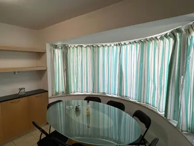 a dining room with a glass table and chairs at Villa Sawa by Ezoria Villas in Limassol