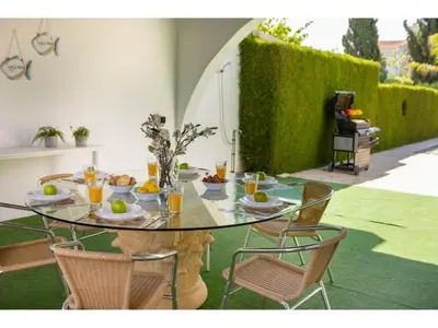 a glass table with food on it on a patio at Protaras Apollon Seaside Villa in Protaras
