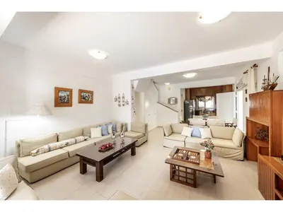 a living room with a couch and a table at Protaras Apollon Seaside Villa in Protaras