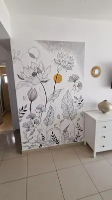 a wall with a mural of flowers on it at Cyprus Dreams Village in Protaras