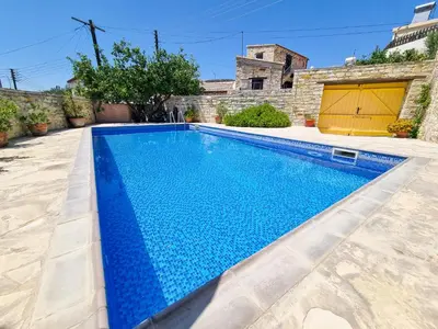 a swimming pool in the backyard of a house at Skarinou Village Poolside Escape Studio with Pool facilities in Skarinou