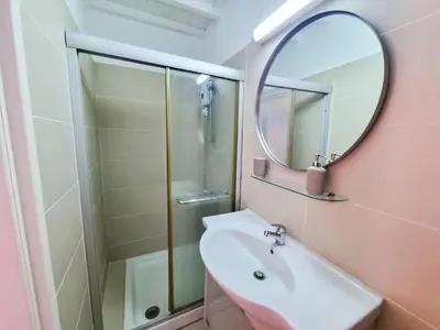 a bathroom with a sink and a mirror at Skarinou Village Poolside Escape Studio with Pool facilities in Skarinou