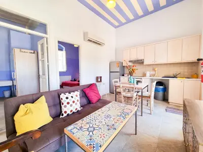 a living room with a couch and a table at Village Charm with Pool Apartment at Skarinou in Skarinou