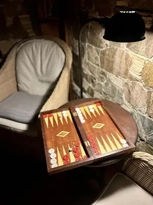 a table with a box on it next to a chair at FIKARDOU ALMOND PARK in Phikardhou