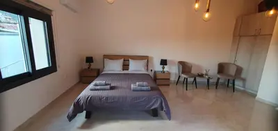 a bedroom with a bed with two towels on it at Village Gem Peledri Studio in Pelendri
