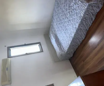 a small bedroom with a bed and a window at Impeccable 3-Bed Villa in Nicosia in Yukarı Lakatamya