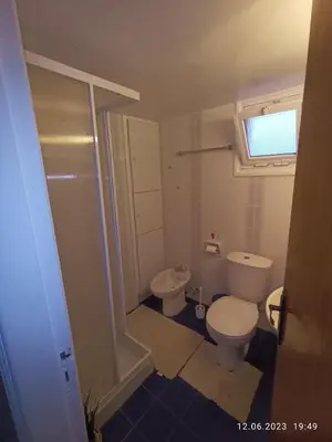 a small bathroom with a toilet and a sink at Ferienhaus_FamilyKrausz in Pervolia