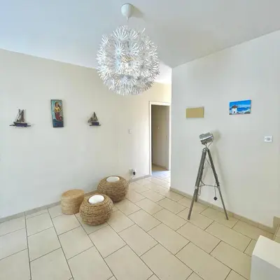 a room with a camera and a chandelier in it at Mediterranean Breeze Villa in Protaras