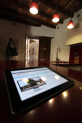 a tablet computer sitting on a table in a kitchen at River House in Kakopetria