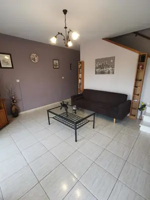 a living room with a couch and a table at Oroklini Hideaway in Voroklini
