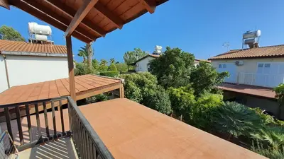 a balcony of a house with a roof at Manors Seaside 2BR House 100m from the Beach & Free Parking in Meneou