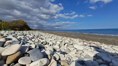 a large group of rocks on a beach at Manors Seaside 2BR House 100m from the Beach & Free Parking in Meneou