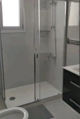 a bathroom with a shower and a sink at Nice flat in Tseri