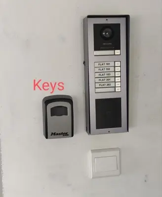 a pay phone is attached to a wall at Nice flat in Tseri