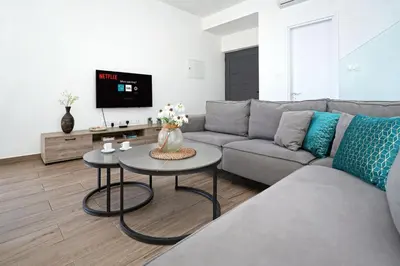a living room with a couch and a table at Villa Celestia in Protaras