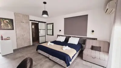a bedroom with a bed and a couch at Nissi avenue 64 Studio 3 - Luxcyservices in Ayia Napa
