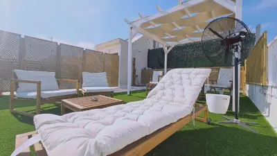a large white couch sitting on top of a patio at STAY Napa Aura Apartment in Ayia Napa