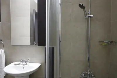 a bathroom with a shower and a sink at Rifugio Retreat in Kakopetria