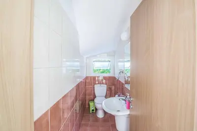 a bathroom with a toilet and a sink at Villa Armostia in Protaras