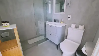 a bathroom with a toilet and a shower and a sink at STAY Monte Elias Apartment in Protaras