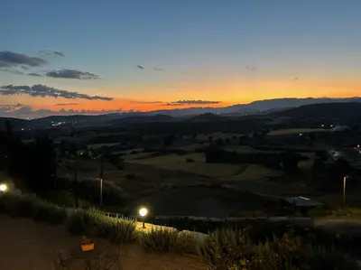 a view of a sunset from the top of a hill at Endless Sunset in Pendakomo